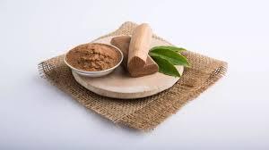 Traditional Ayurvedic ubtan ingredients turmeric, sandalwood, gram flour, and neem powder